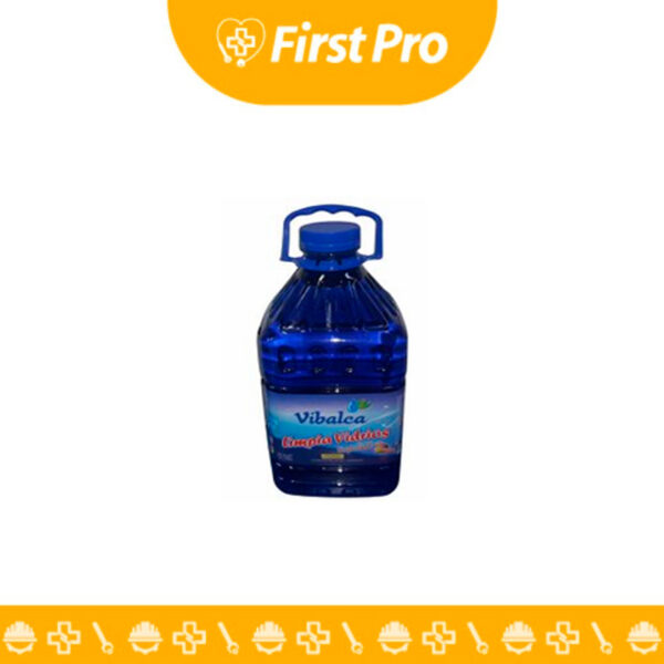Envase de plástico tipo galón (3.785 L) con tapa rosca, lleno de Limpiavidrios VIBALCA líquido de color azul o verde claro. La etiqueta resalta la marca VIBALCA, el volumen del galón, y la promesa de limpieza sin rayas y secado rápido.